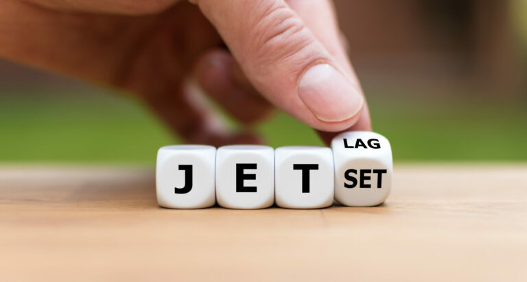 dice spelling out jet lag