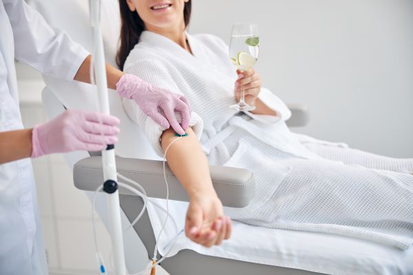 IV vitamin replacement therapy concept, woman getting IV