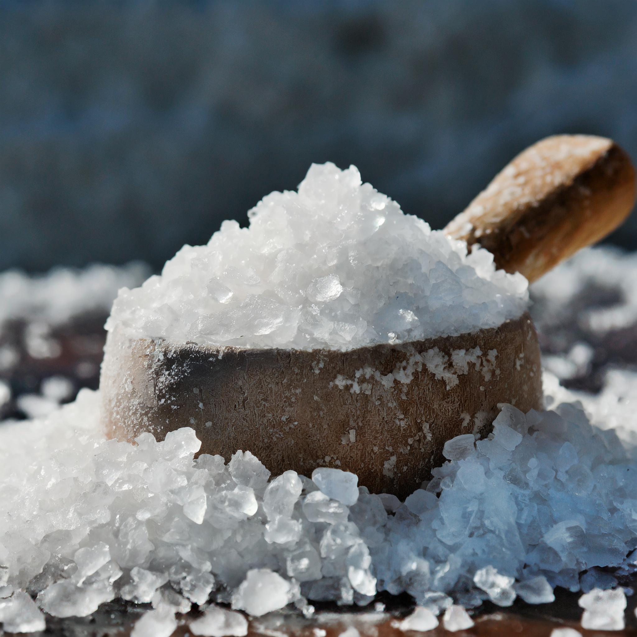 chunky salt crystals in large wooden spoon